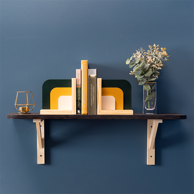 Painted Squared Arch Bookend Kit in Boho Palette on shelf against blue wall